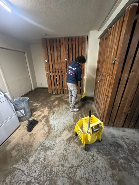 Emergency Mitigation Services technicians working a multi-unit apartment flood in Kansas City, Missouri