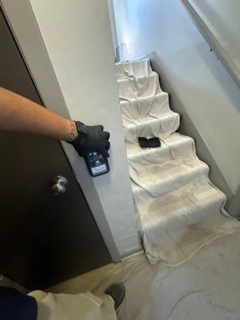 Emergency Mitigation Services team responding to rising flood water damage at an apartment complex