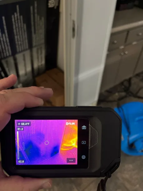Second thermal imaging scan identifying trapped moisture in the raised floor system for meter verification