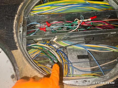 Data cabling in the channel beneath a raised access floor panel at the flooded Olathe office