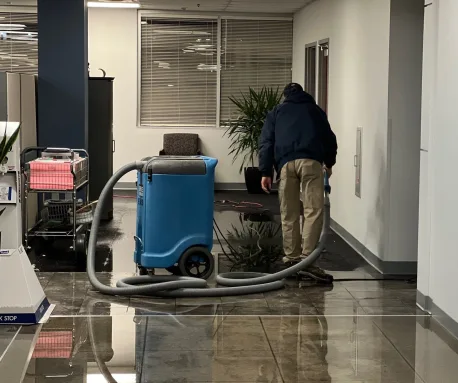 Emergency Mitigation Services technicians working the commercial water loss at the Olathe office