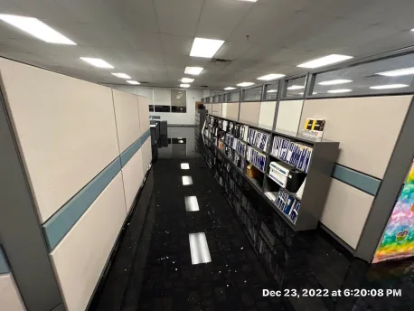 Standing water pooled across commercial office flooring after a frozen sprinkler line burst